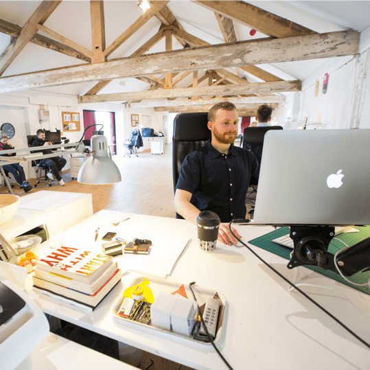 Digital marketer working in a cozy office