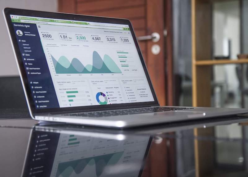 a laptop with a graph on the screen